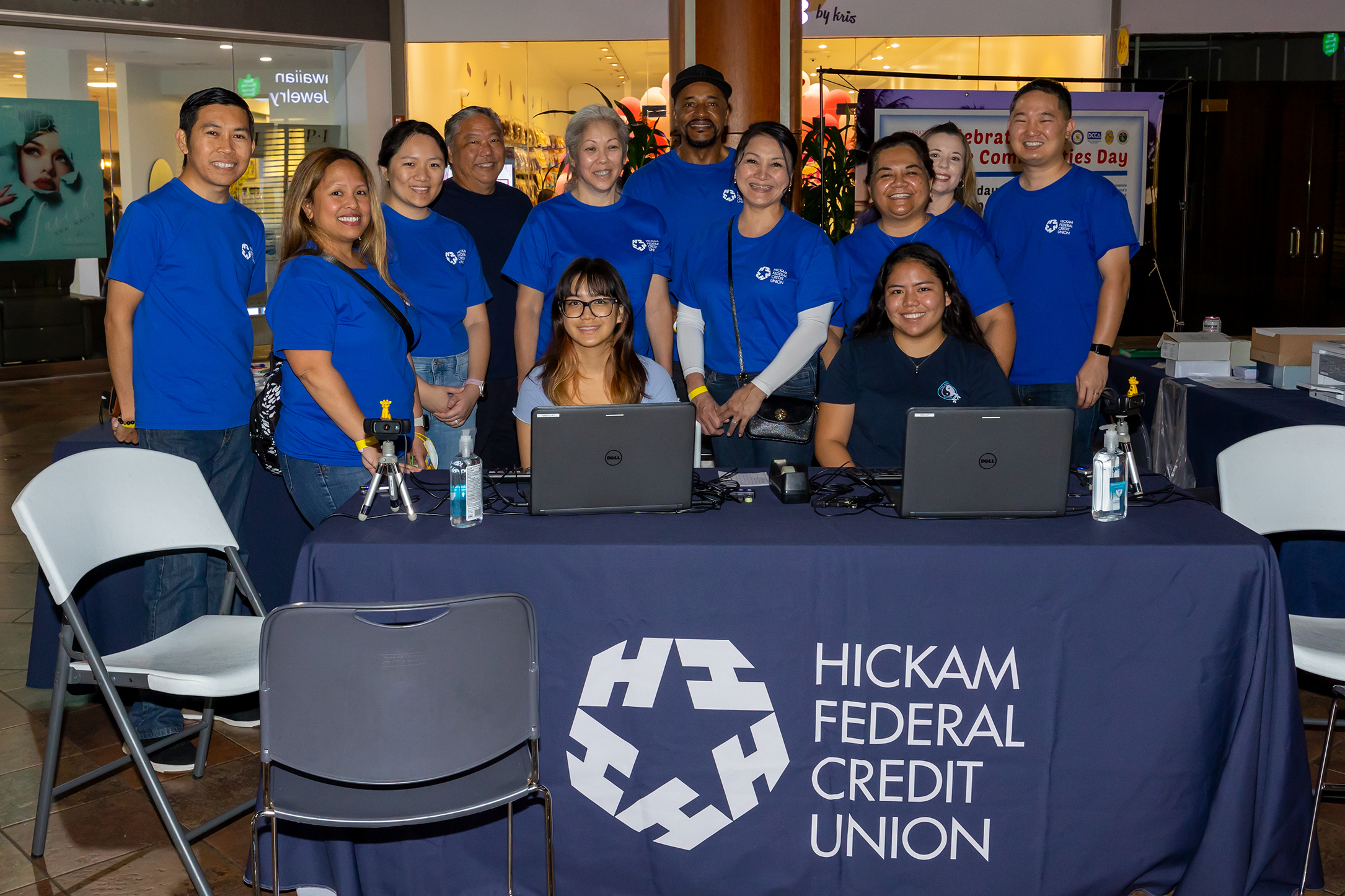 A group of Hickam FCU volunteers pose at the keiki ID booth