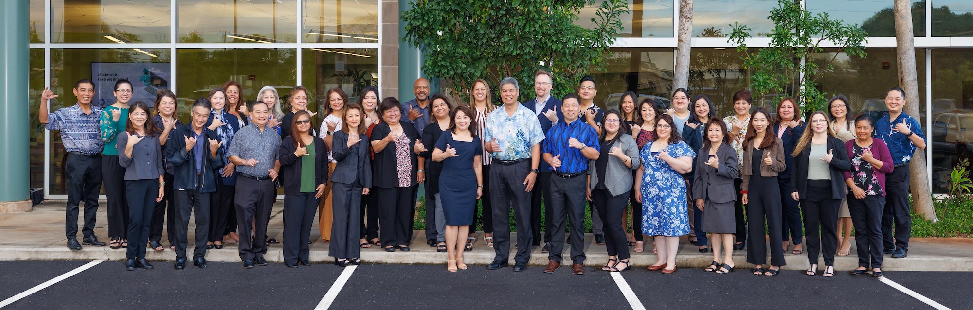 Hickam FCU staff posing in front of Pearl City Branch